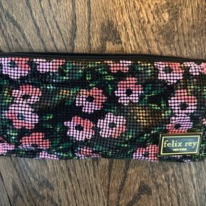 Felix Rey mesh disco daisy pouch. So fun!